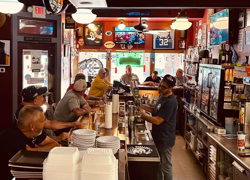 The bar at Rizz's in the afternoon, Pittsburgh memorabilia on the walls
