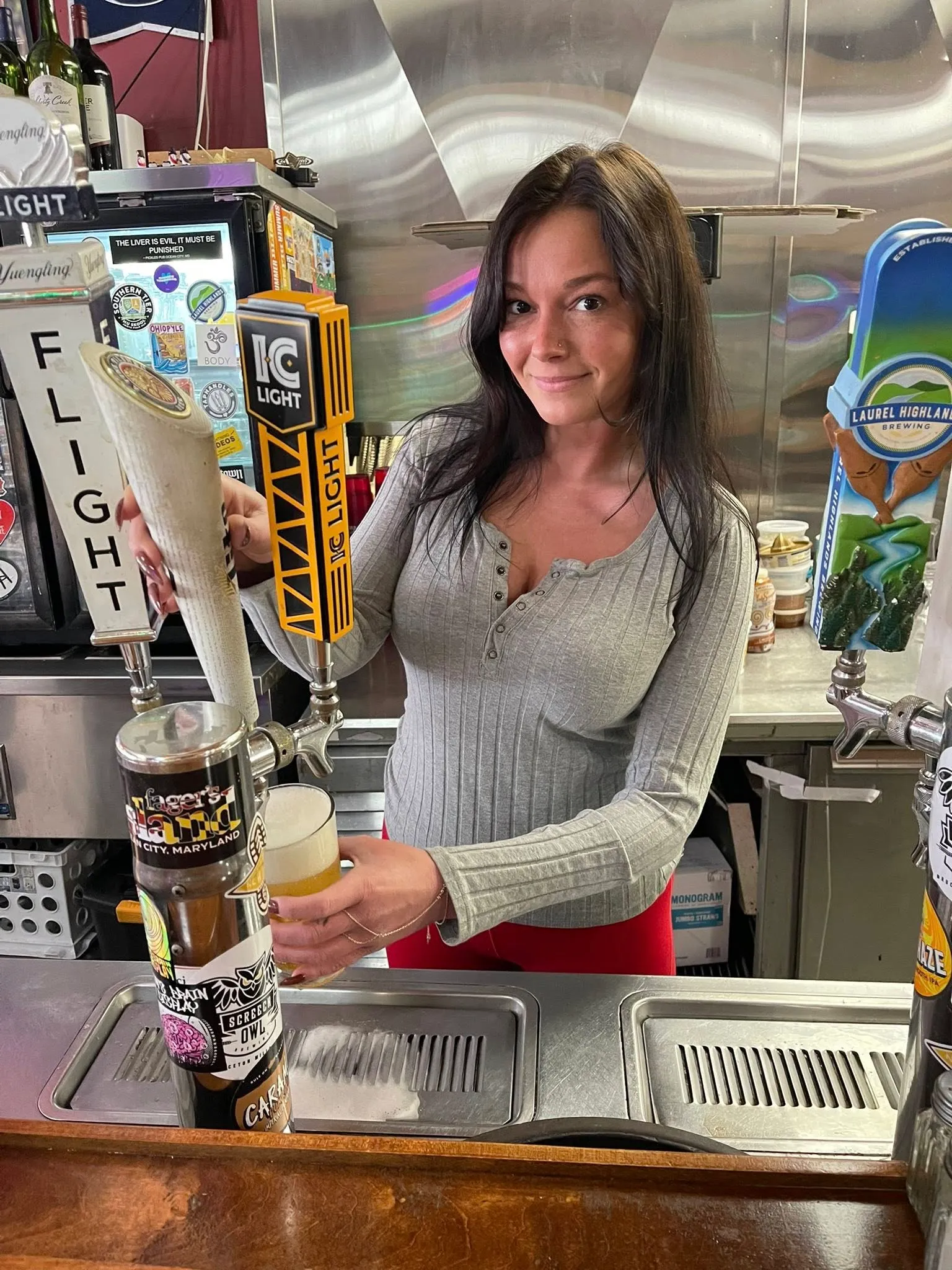 Bartender pouring an IC Light flight