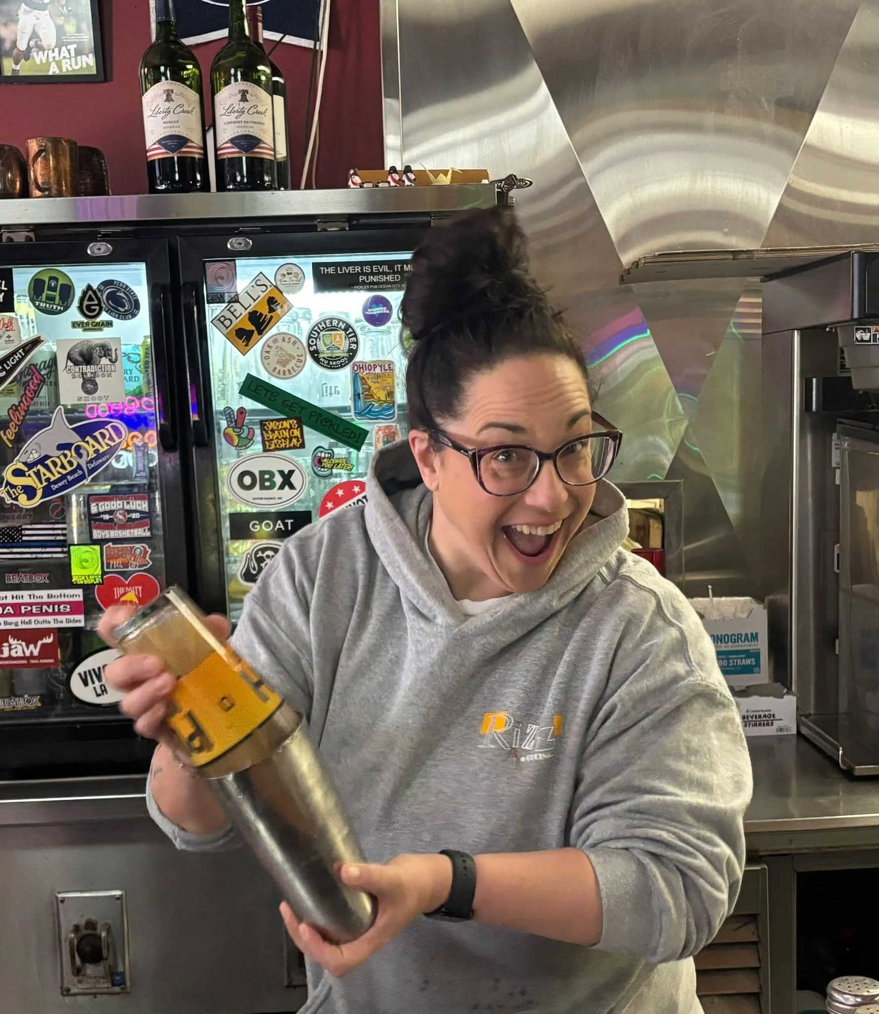 Bartender shaking a cocktail, laughing