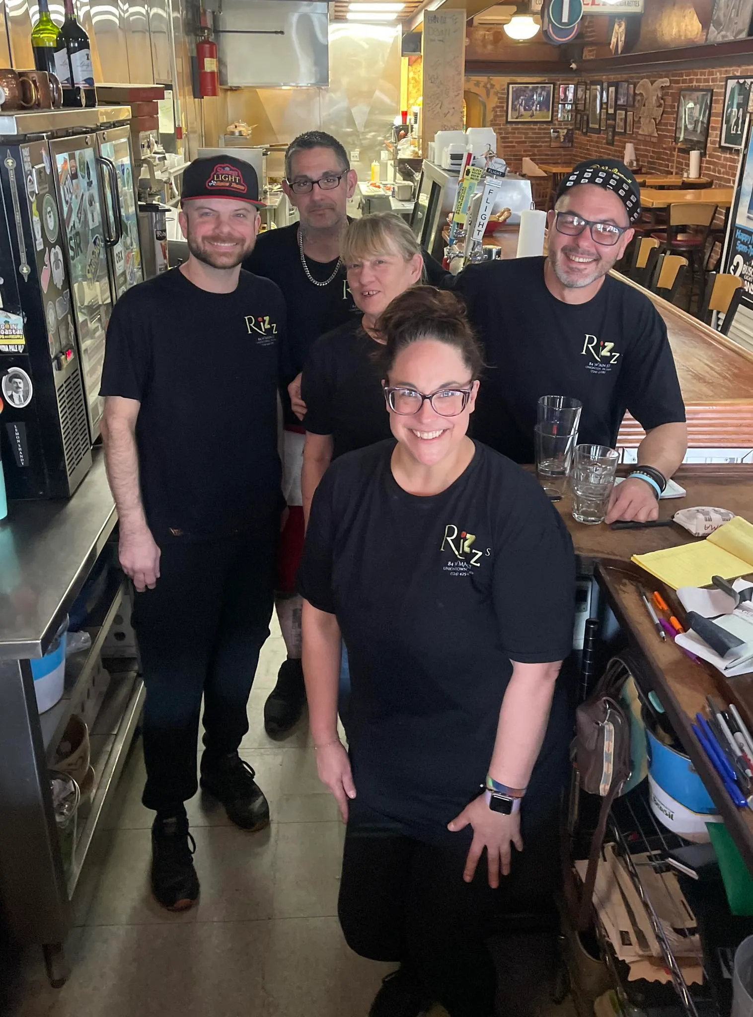 The Rizz's team in their branded shirts